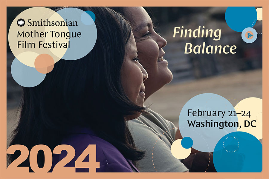 Text: Smithsonian Mother Tongue Film Festival, 2024. February 21 to 24. Washington, DC. Background design is a film still of two people smiling, looking right into the distance, with an illustrated frame of pale pink, blue, and yellow circles.